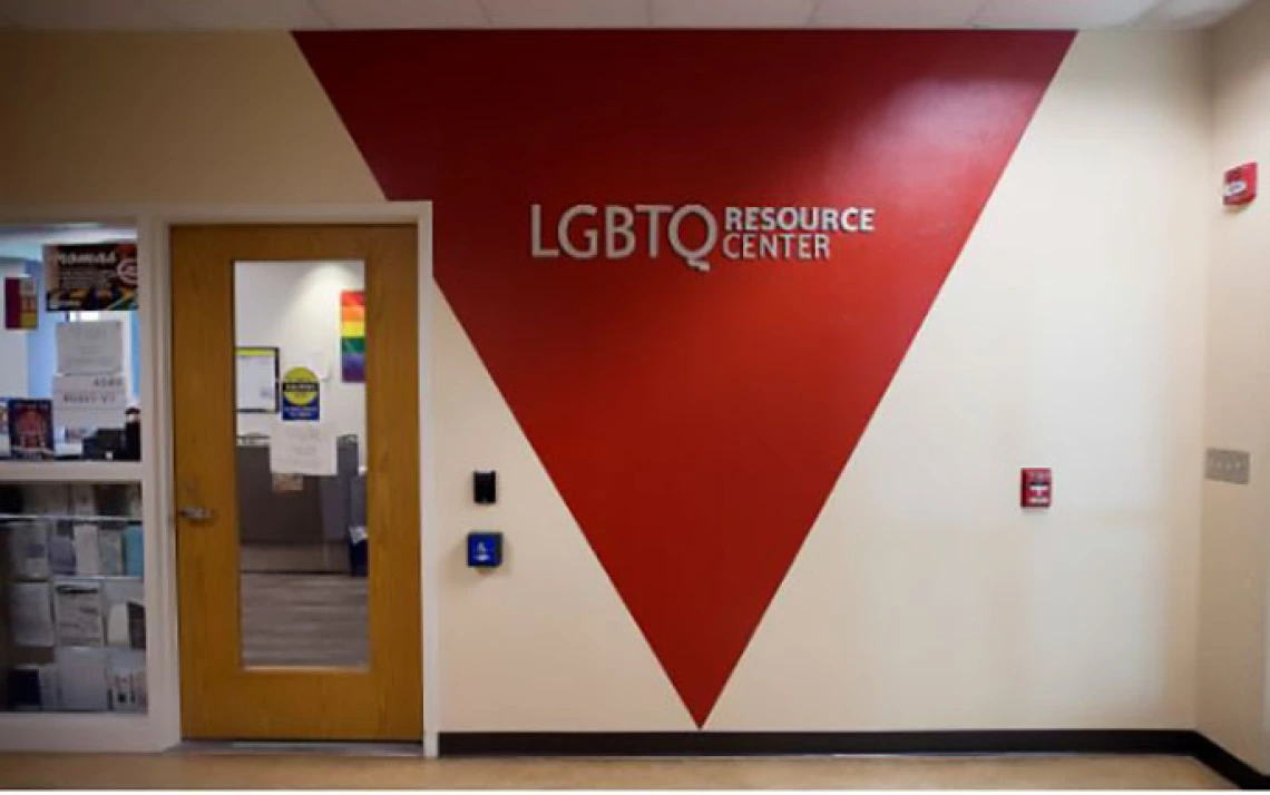 Hallway wall with "LGBTQ Resource Center" painted inside a red triangle