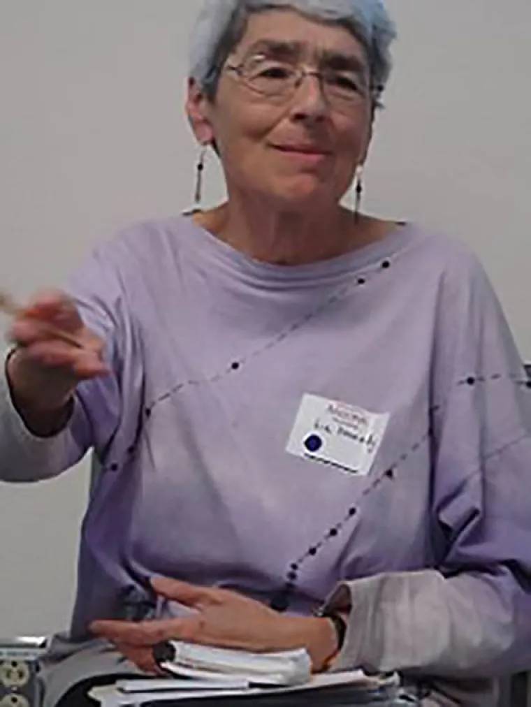 Dr. Liz Kennedy moving hands while speaking